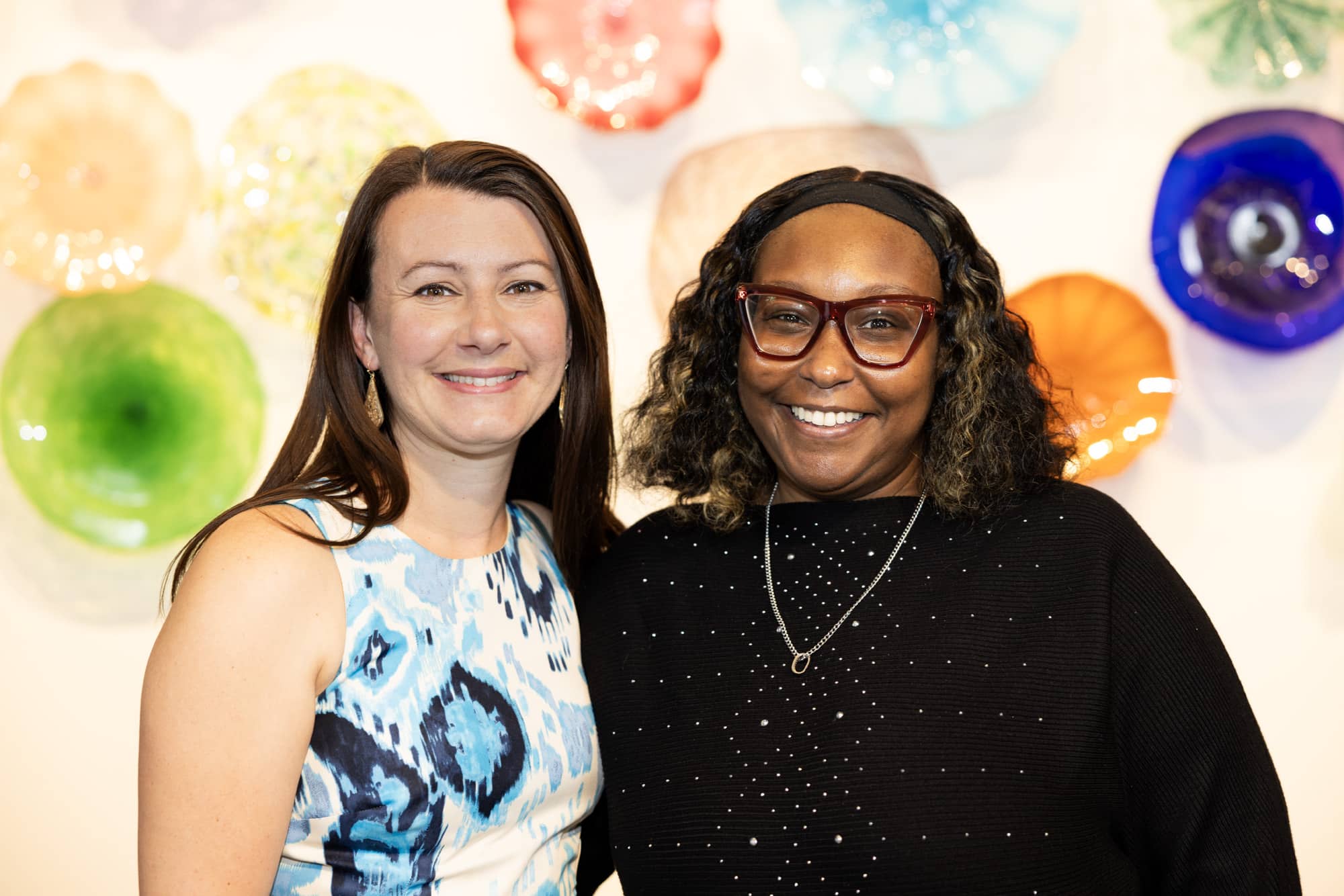 Jamie Townson stands with her financial coach Sasha Moore as they celebrate her success.